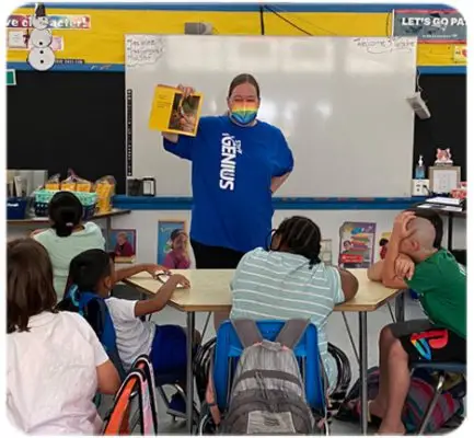 Teacher reading a book