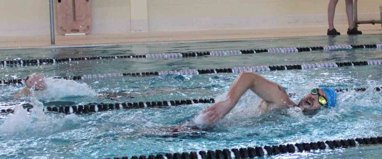 Justin Deflumeri swiming in Adult Tri at the Y