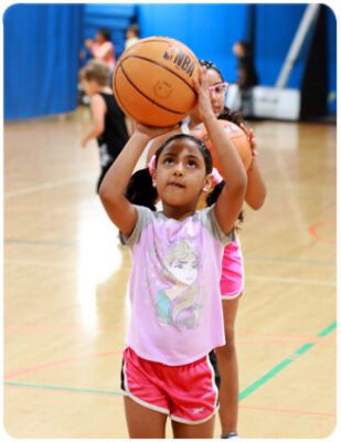 Camper Playing Basketball