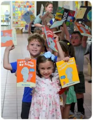 Kids holding up books