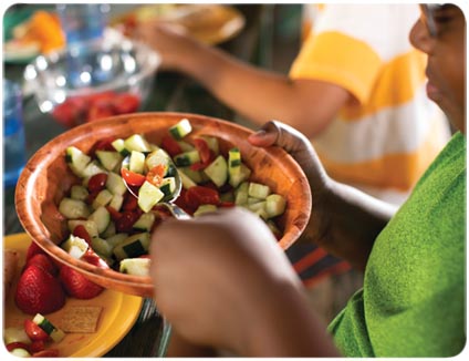 Child eating a healthy salad