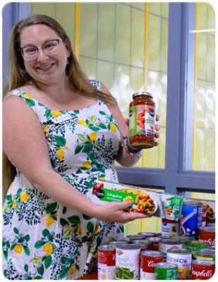 Employee taking Food Donations from Membership Drive